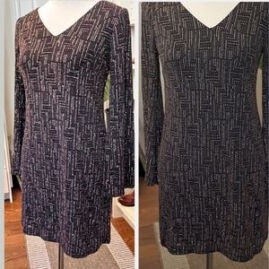 Black and gold glitter sparkle long sleeve V-neck dress.
